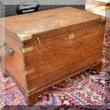 F36. Harry Henderson trunk with brass braces and handles. 18”h x 26”w x 16”d 